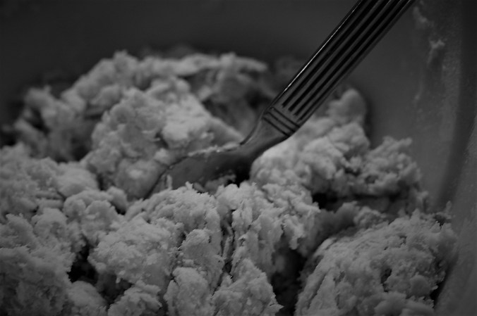 Fork in stiff biscuit dough